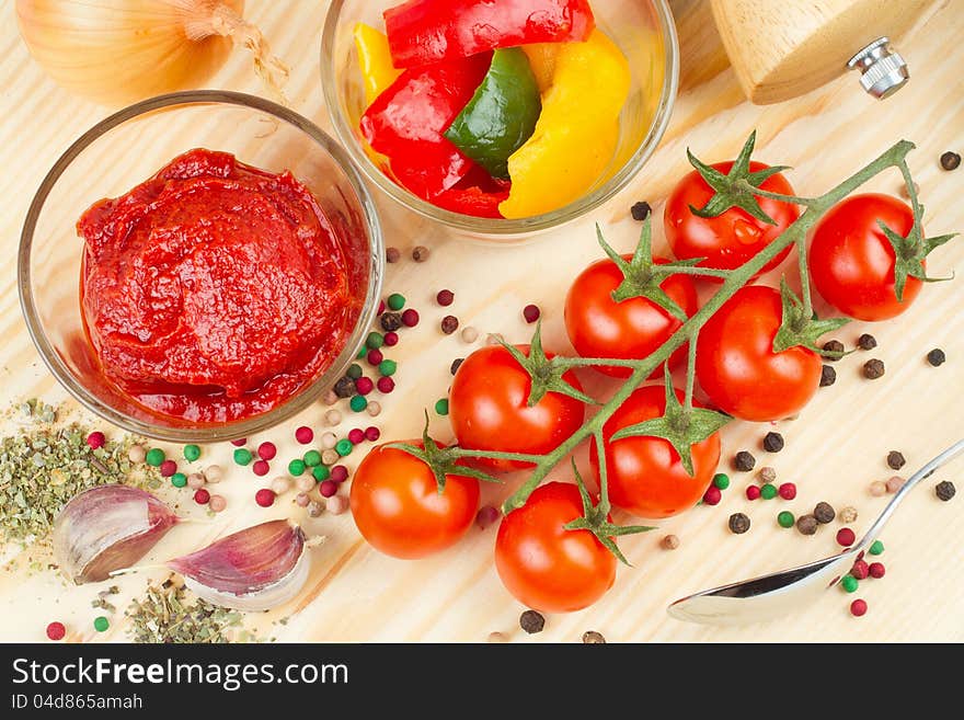 Ingredients for making  sauce from tomato and  bell pepper, vegetable and spice on cutting board. Ingredients for making  sauce from tomato and  bell pepper, vegetable and spice on cutting board