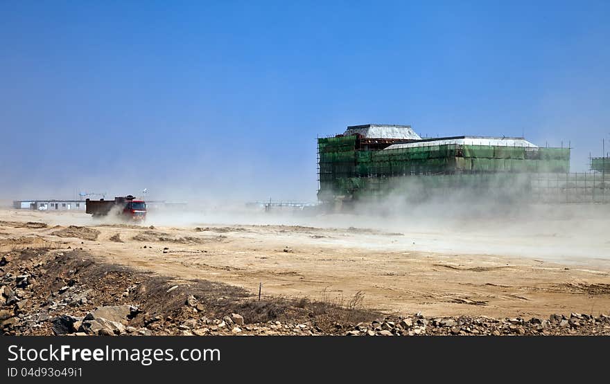 A truck running through a construction site