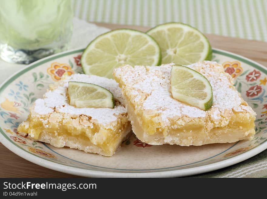 Two lime bars with lime slices on a plate