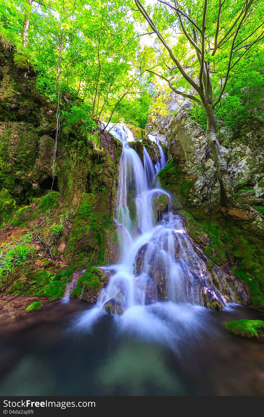 Peacefully flowing stream and waterfalls