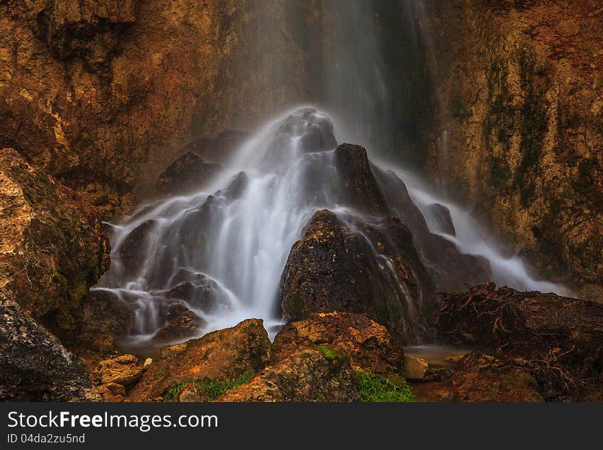 Peacefully flowing stream and waterfalls