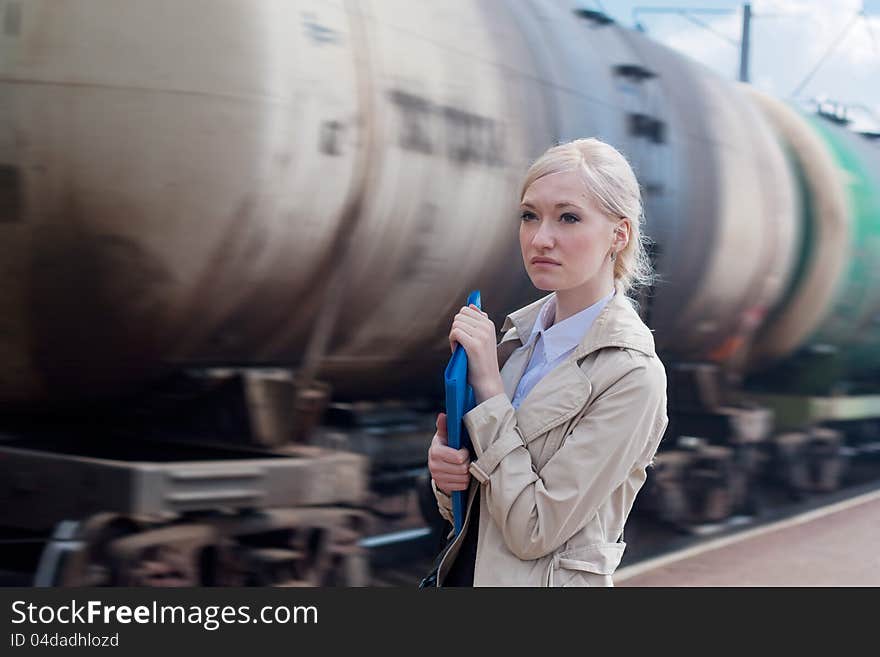 Girl on the background of a moving railway tank. Girl on the background of a moving railway tank