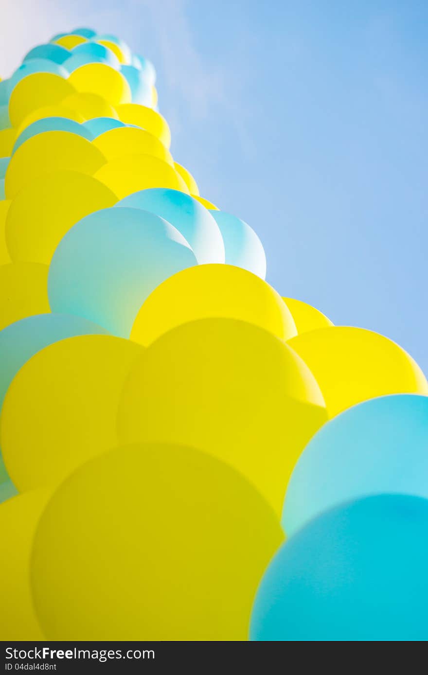 Balloons on a background blue sky . Balloons on a background blue sky .