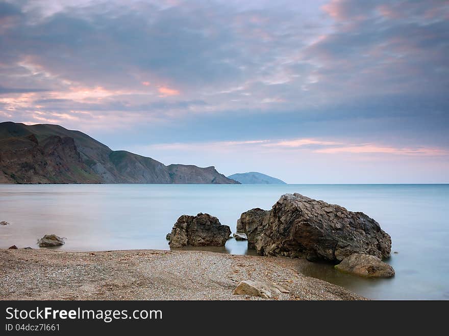 Sea landscape with cape and the cloudy sky. Crimea, Ukraine.