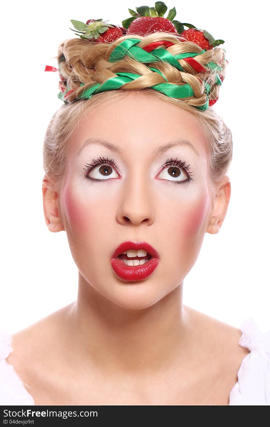 Woman with strawberry in her hairstyle over white background