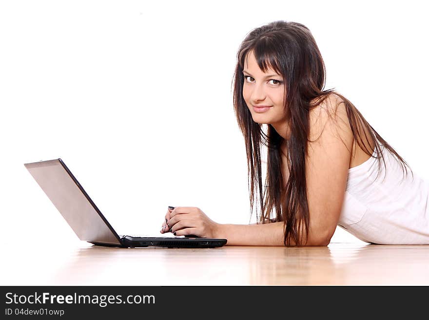 Young and beautiful girl with laptop at home. Young and beautiful girl with laptop at home