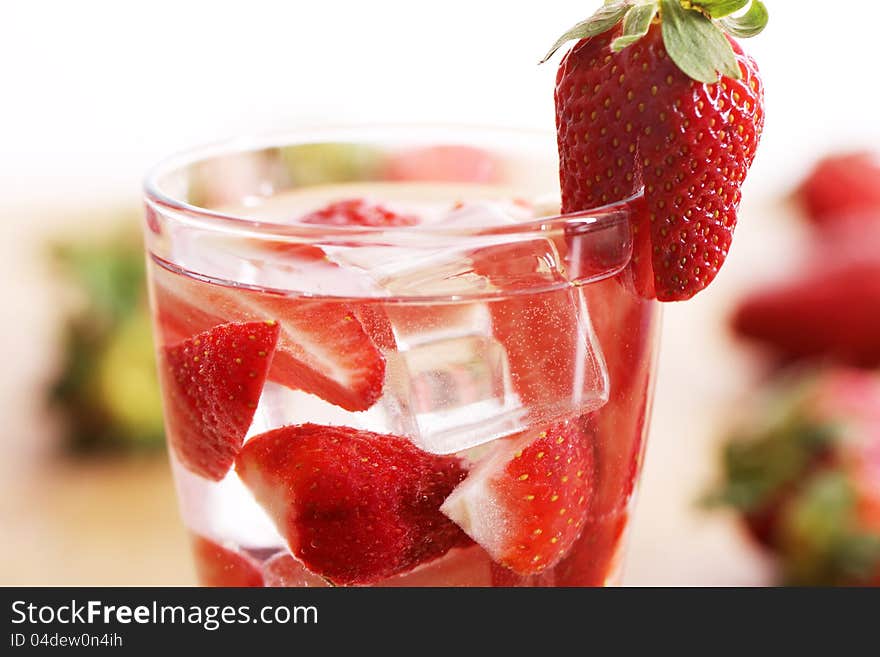 Glass of cold drink with strawberries