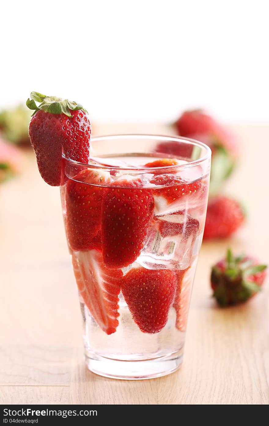 Glass of cold drink with strawberries