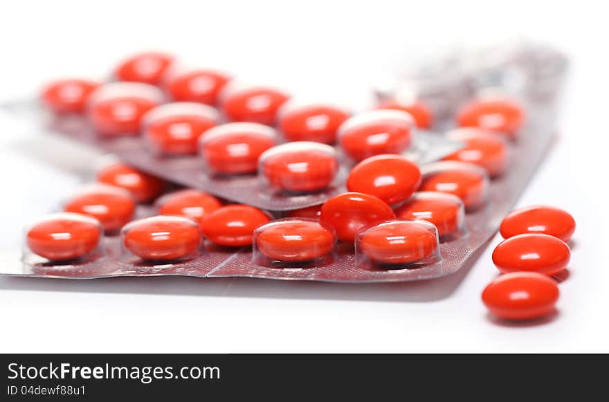 Close up of pills over white background