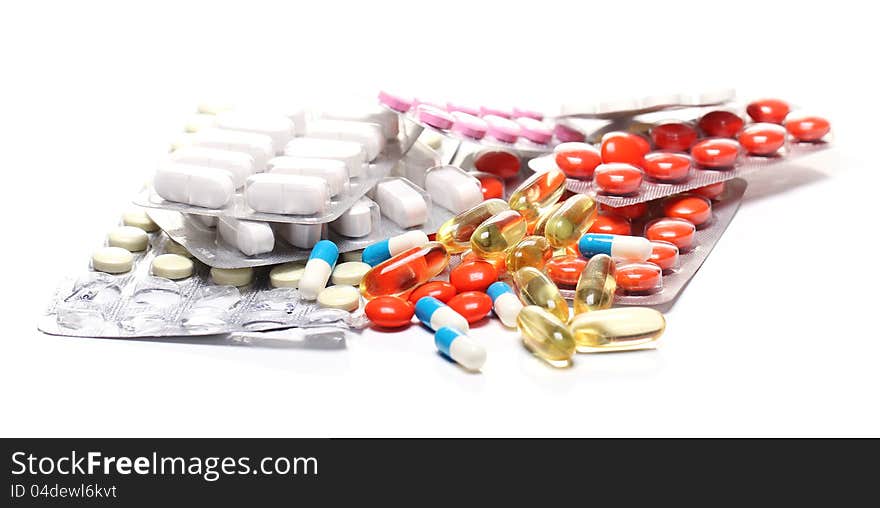 Close up of pills over white background