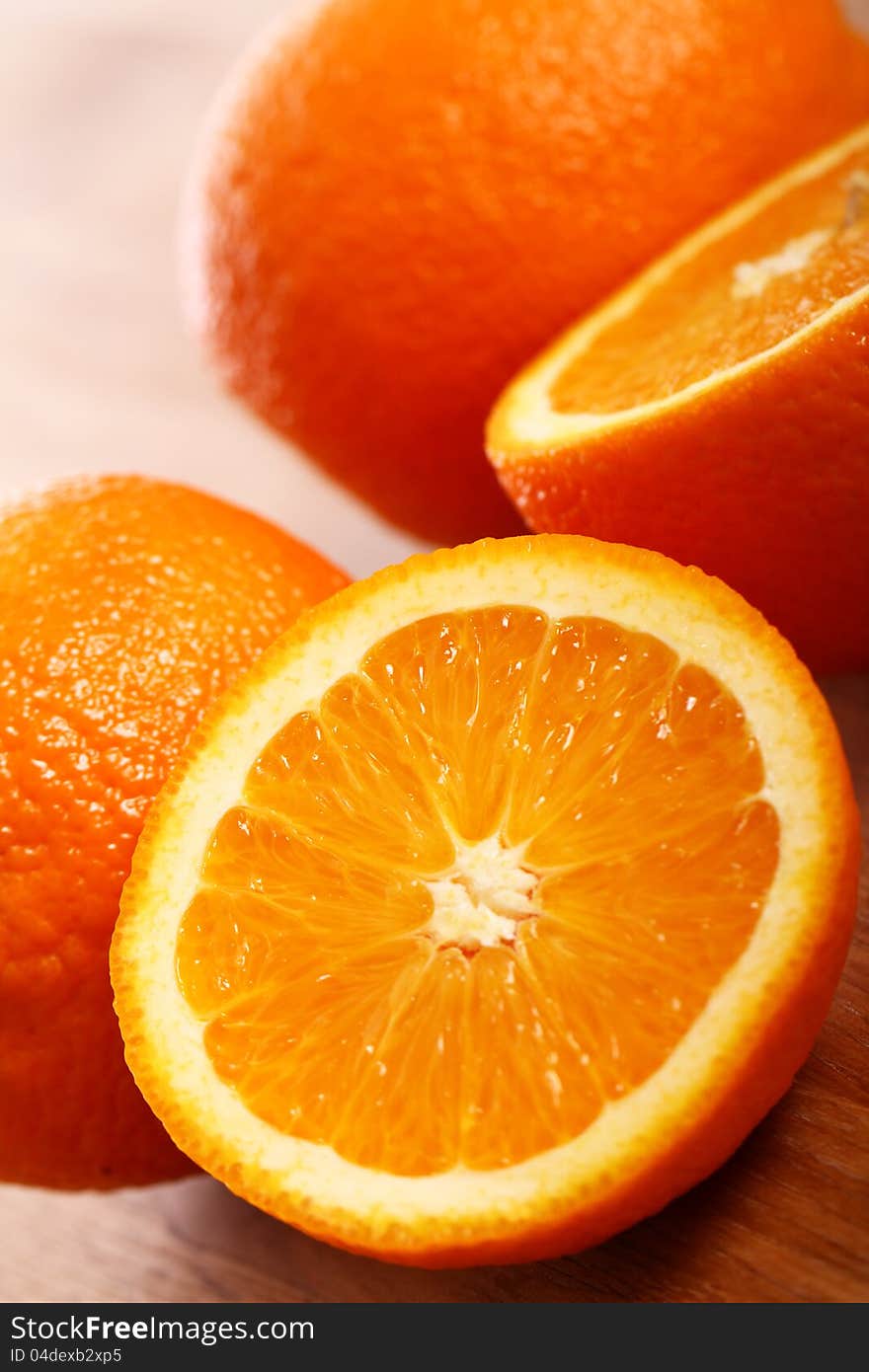 Close up of fresh oranges on wooden board