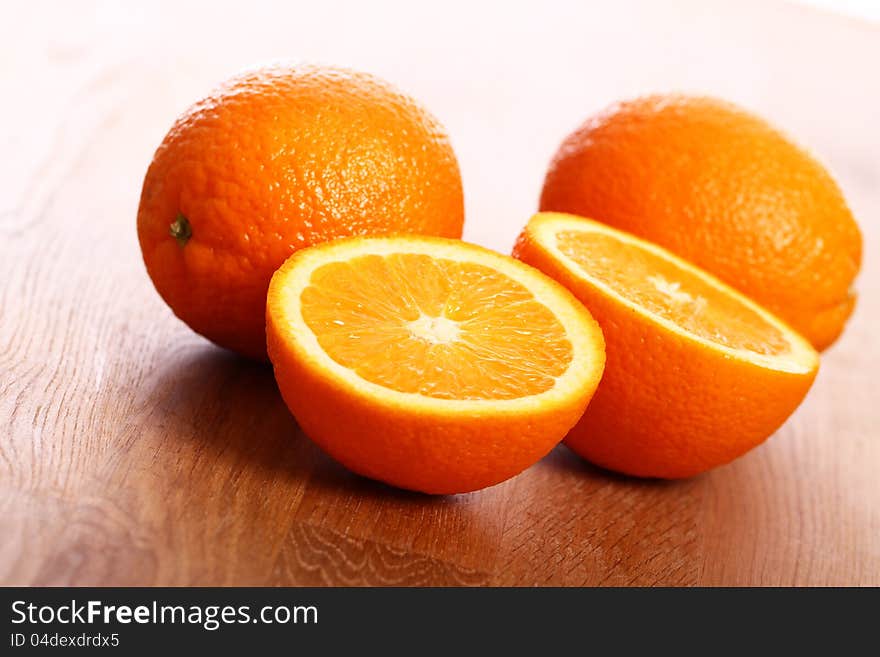 Close up of fresh oranges on wooden board