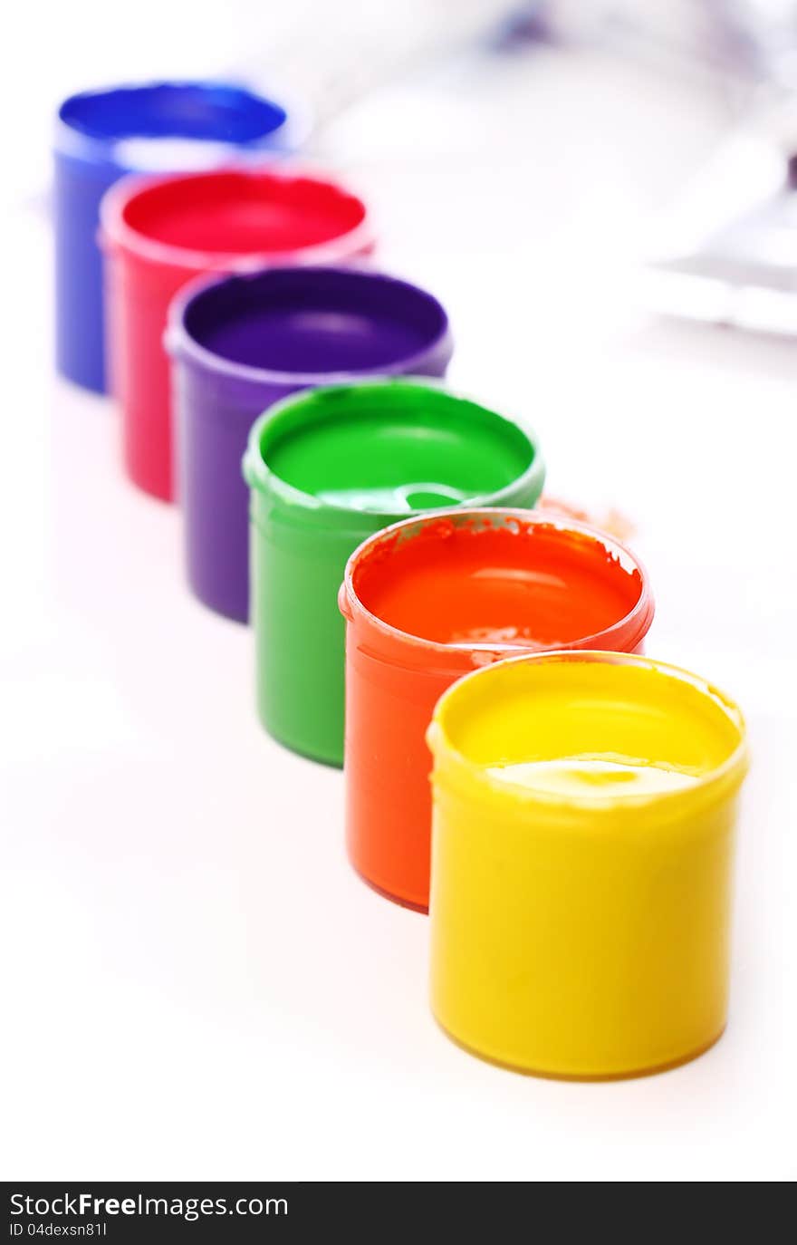 Close up of cans with colorful paint