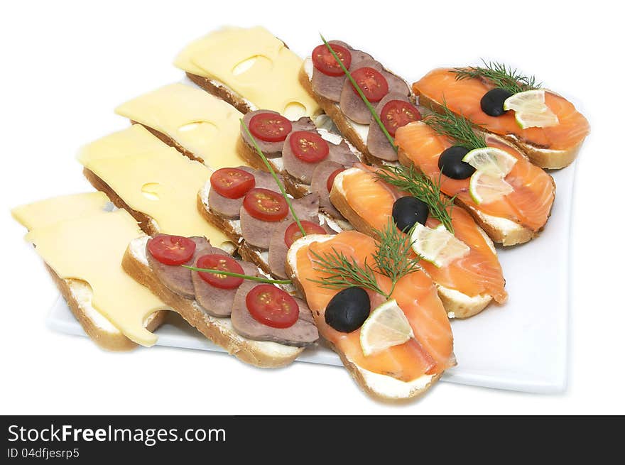 Salmon sandwiches with cheese and rice on a white plate