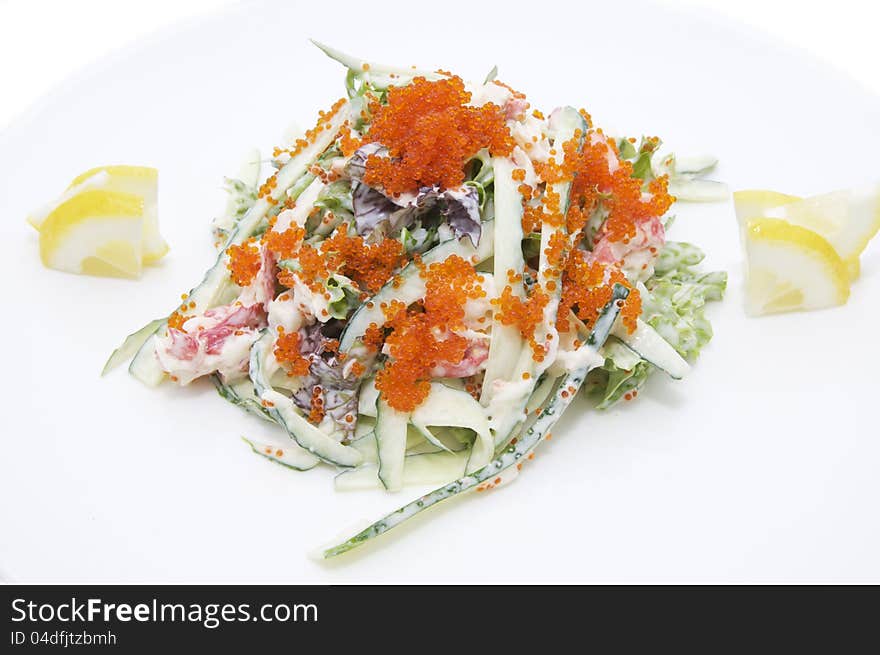 Seafood salad at a restaurant on a white background