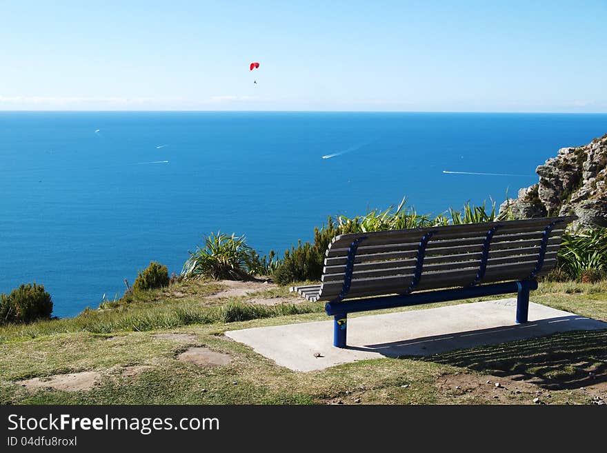 A chair for tourist to have a rest and enjoy the scene. A chair for tourist to have a rest and enjoy the scene