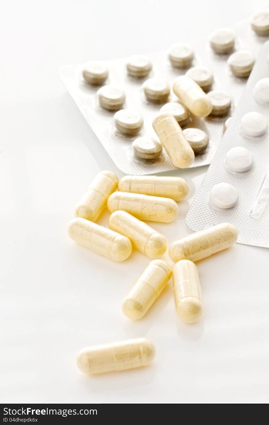 Pills and capsules  on a white background