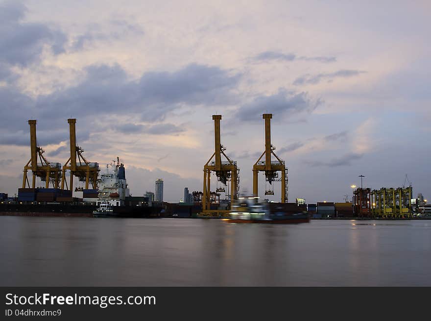 Working harbour cranes in the morning sky. Working harbour cranes in the morning sky