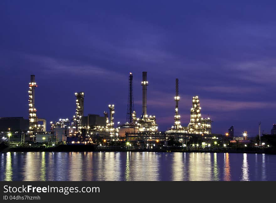 Oil refinery glowing in the twilight. Oil refinery glowing in the twilight