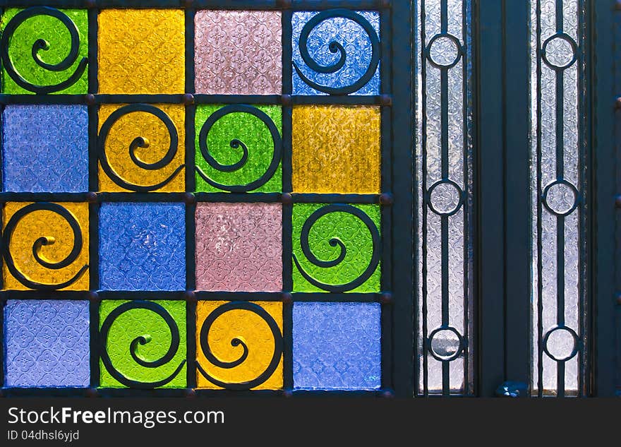 Bright and colorful texture from stain glass door