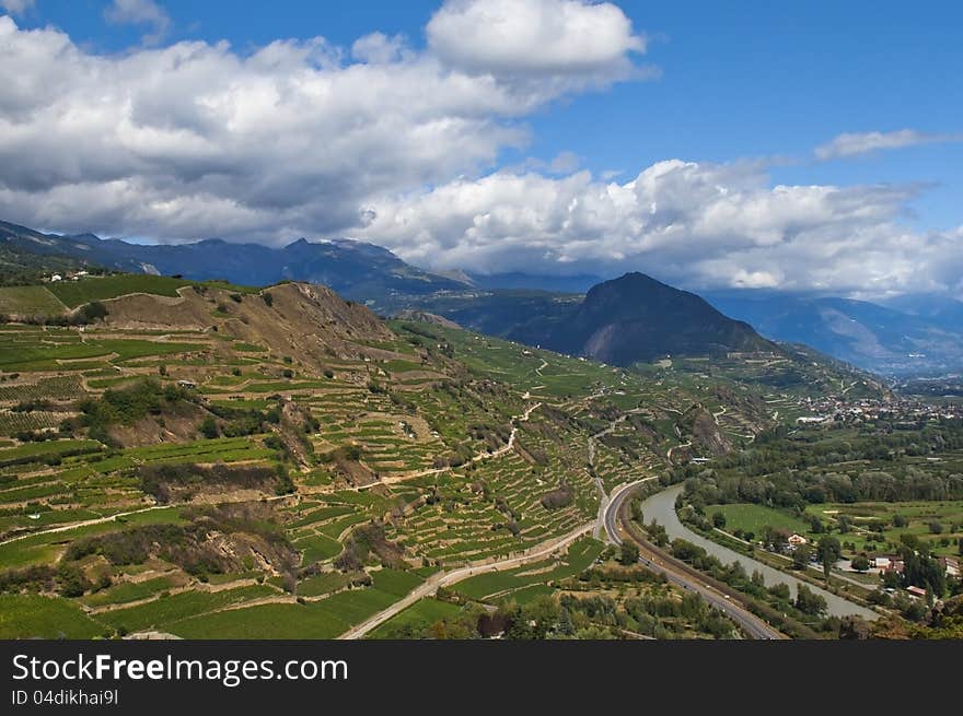 Majestic views of the valley with a river in the mountainous switzerland