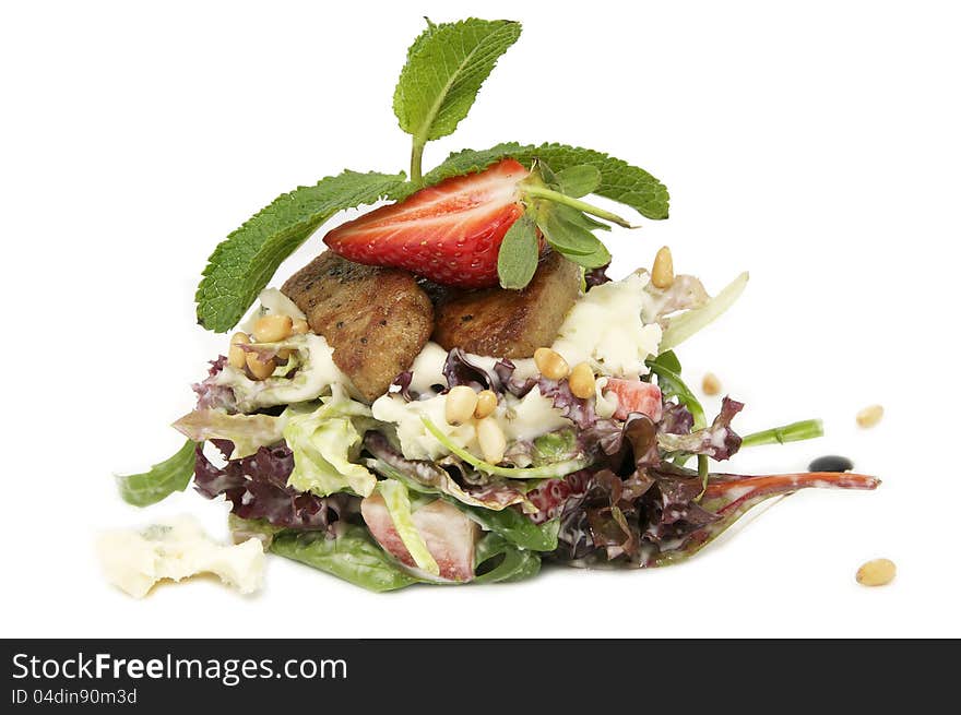 Salad of meat and greens adorned with strawberries. Salad of meat and greens adorned with strawberries