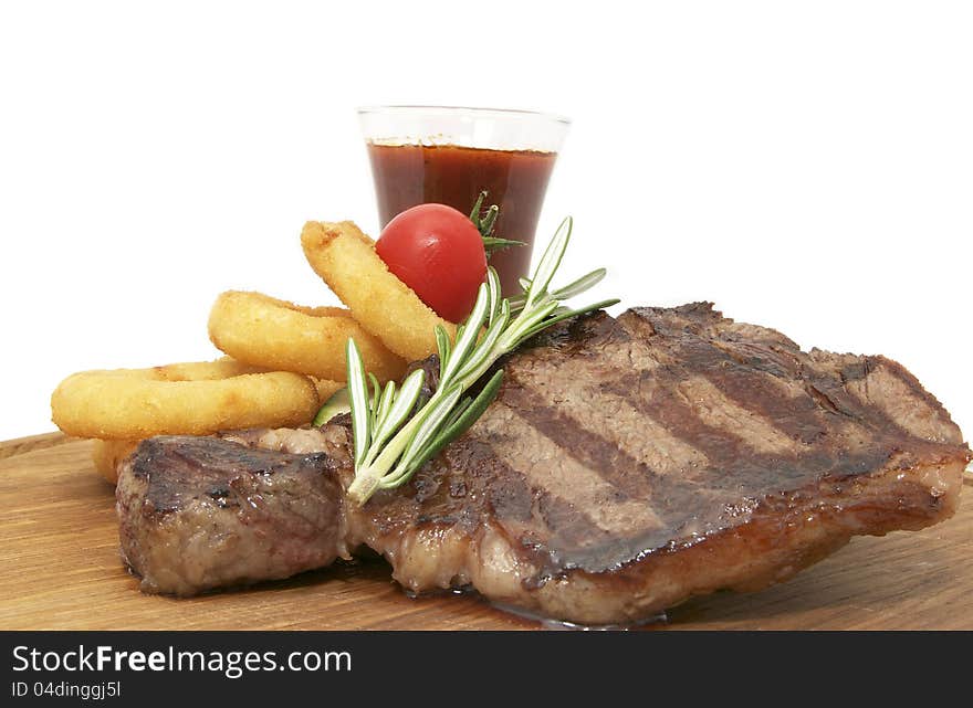 Steak and mashed potatoes with gravy on a white background. Steak and mashed potatoes with gravy on a white background