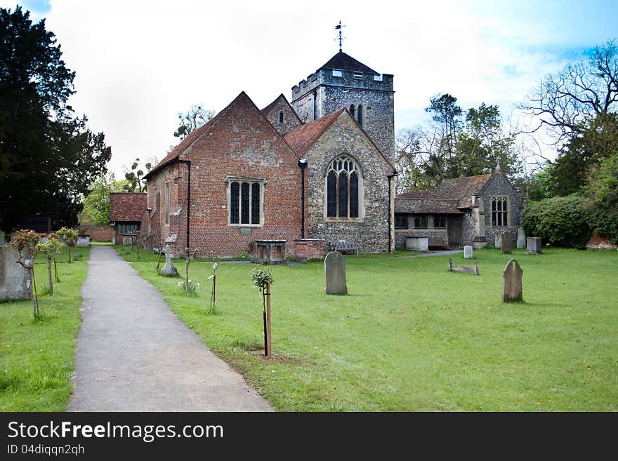 Parish church of St Giles in Stoke Poges England which is the setting for Thomas Grays famous poem Elegy in a Churchyard. Photo shows Thomas Grays tombstone next to a plaque on the church wall which records this as his burial place in 1771. Grays Elegy is one of the most famous poems in the English language and records his grief at the death of his mother who is also buried in the churchyard. Parish church of St Giles in Stoke Poges England which is the setting for Thomas Grays famous poem Elegy in a Churchyard. Photo shows Thomas Grays tombstone next to a plaque on the church wall which records this as his burial place in 1771. Grays Elegy is one of the most famous poems in the English language and records his grief at the death of his mother who is also buried in the churchyard.