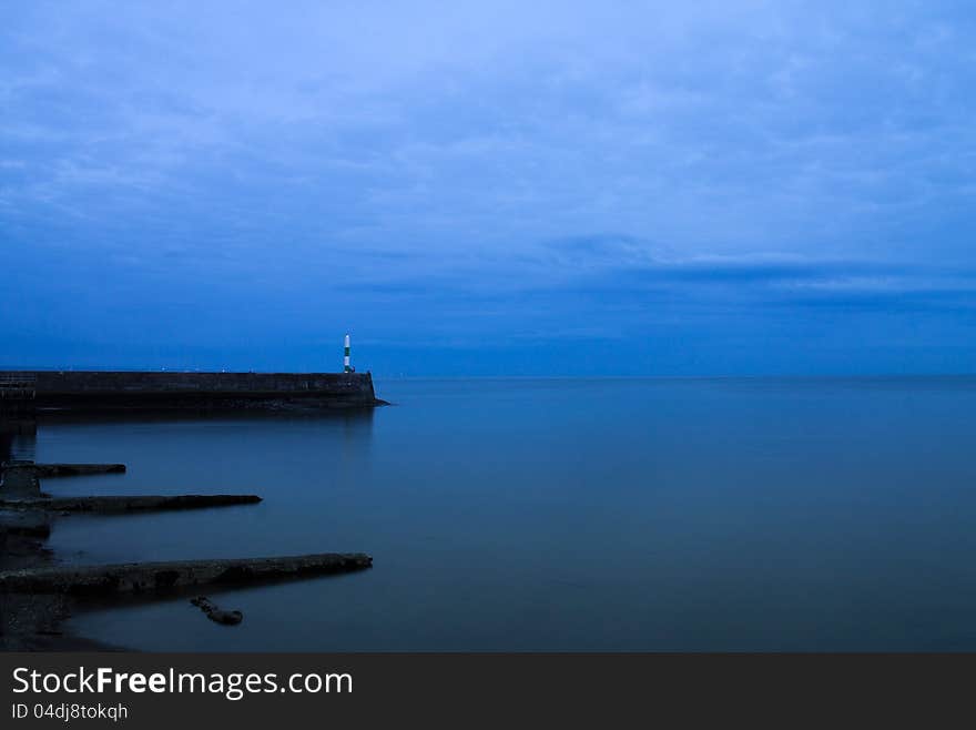 Sea And Lighthouse Early Morning