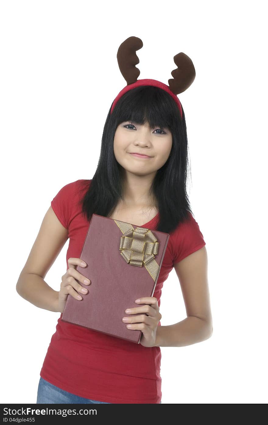 Beautiful asian woman holding christmas gift over white background. Beautiful asian woman holding christmas gift over white background