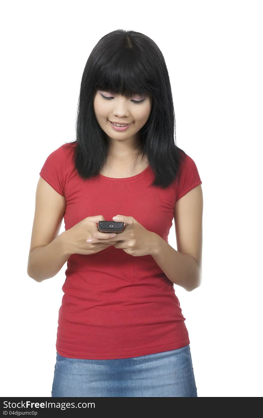 Young asian woman texting using cellphone isolated over white background