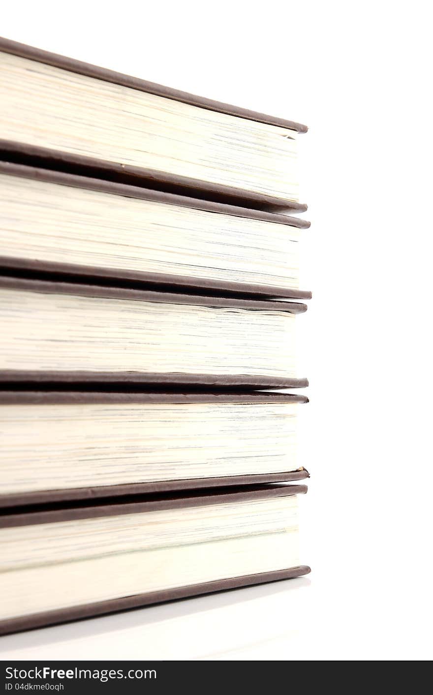 Stack of books on white.