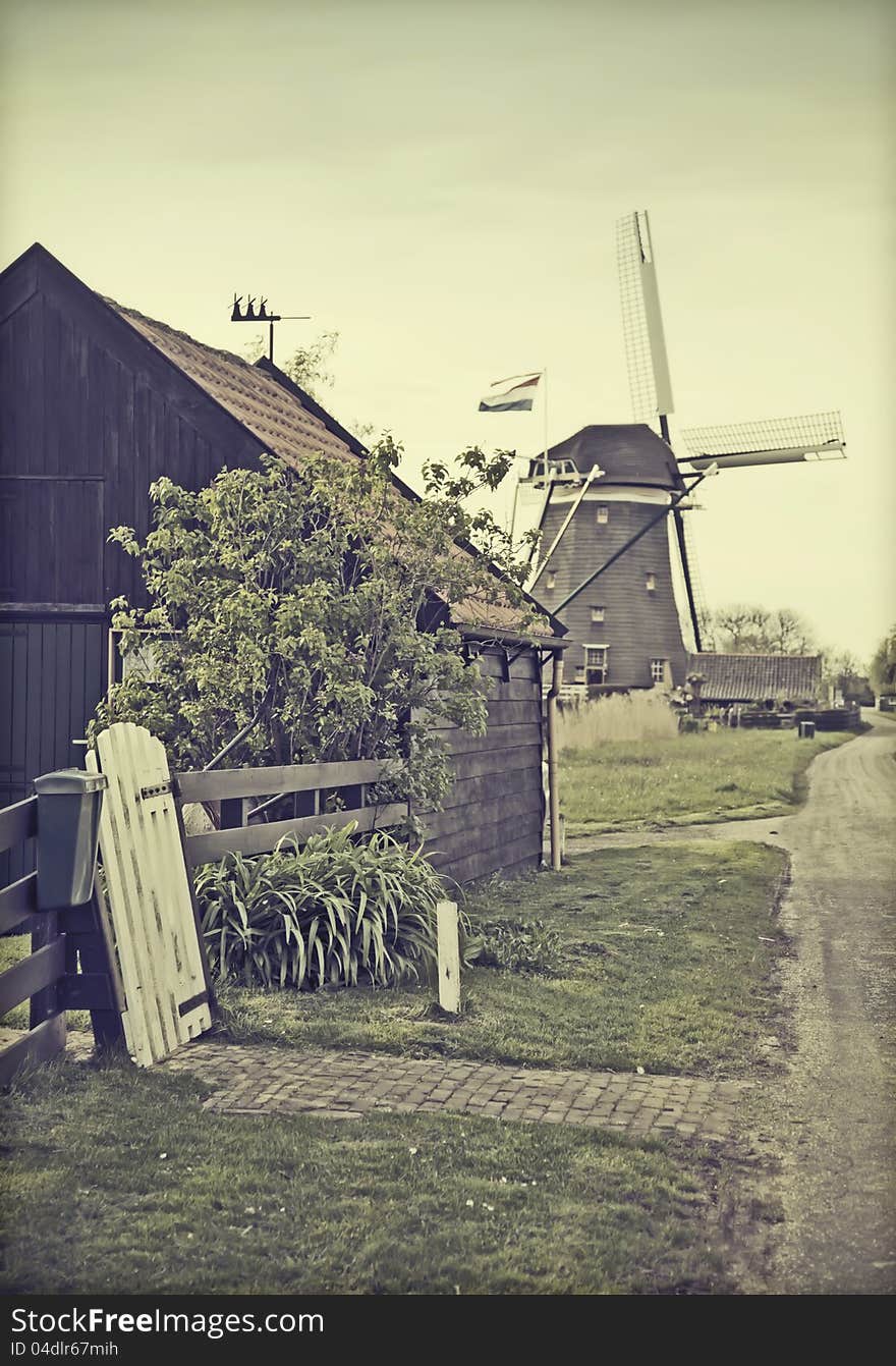 Retro stylish photo of old dutch country-side with windmill. Retro stylish photo of old dutch country-side with windmill