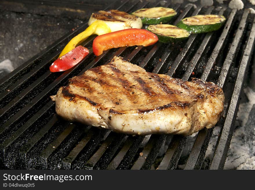 Steaks cooked on a grill in the restaurant