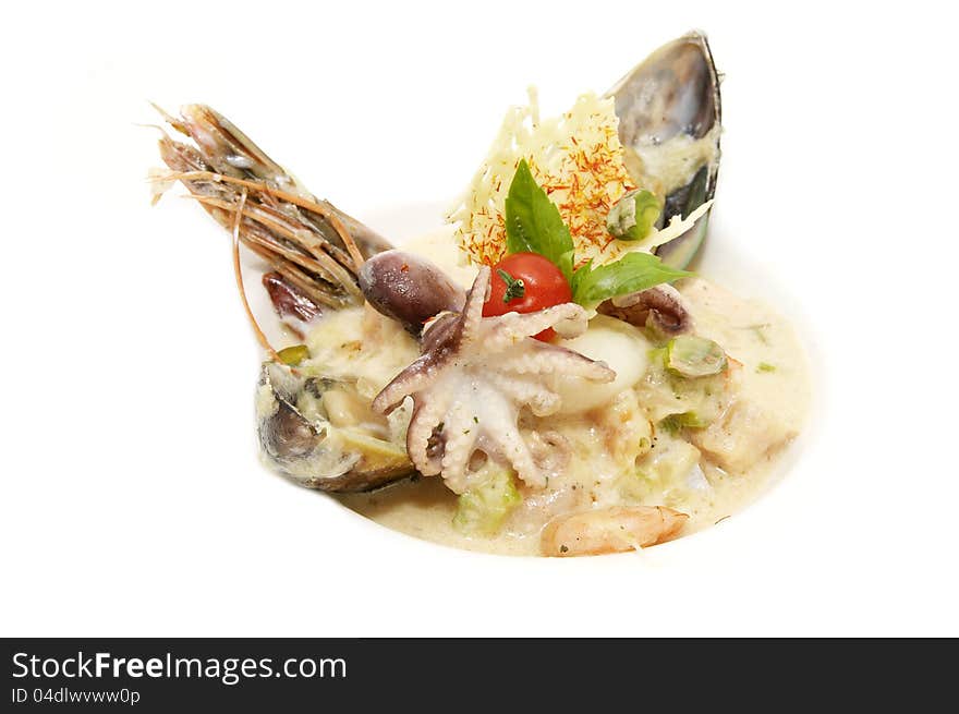 Salad with seafood in a restaurant on a white background