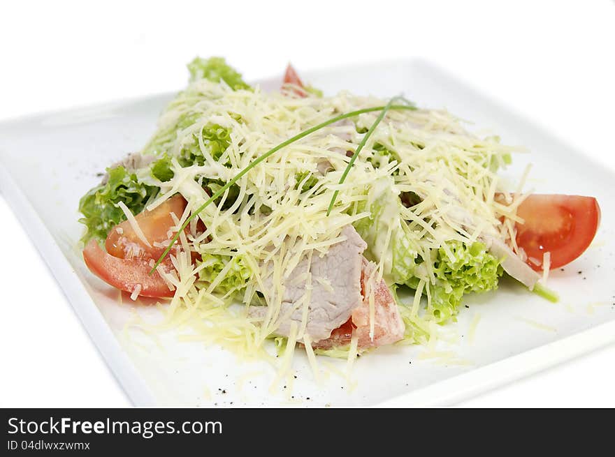 Vegetable salad with oil on a white background