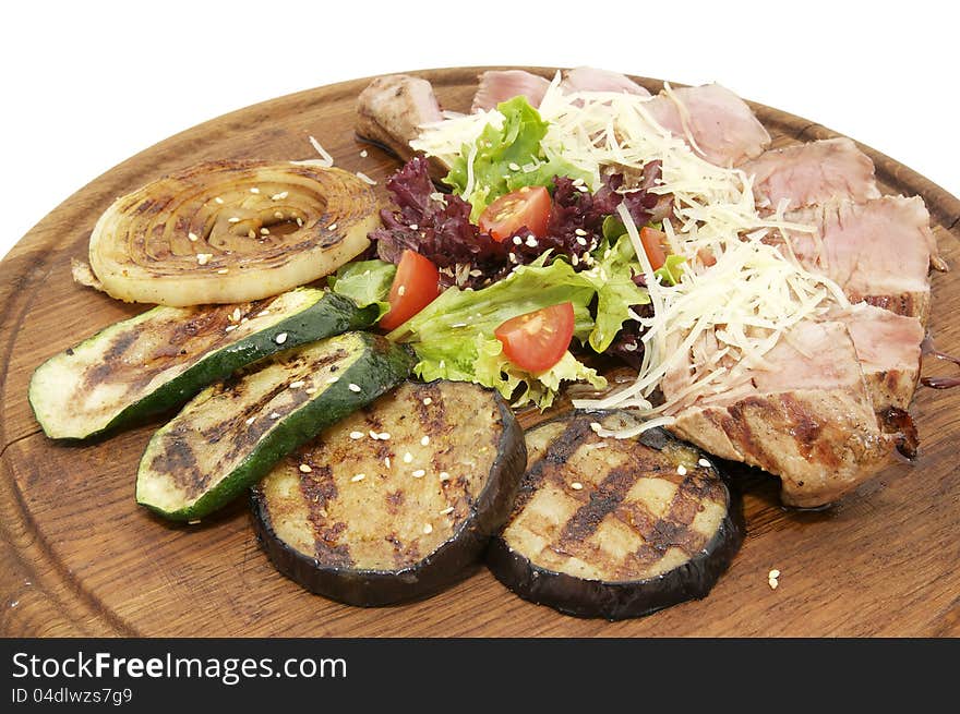 Grilled vegetables in a restaurant on a white background