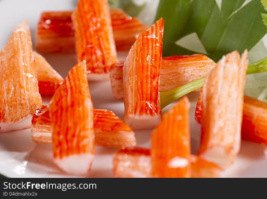 Decorate crab stick in white plate Japanese food.