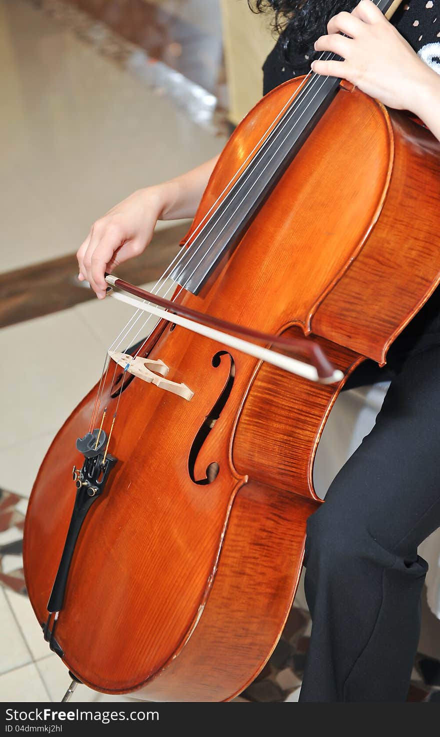 Playing the cello at opera.Bow on cello