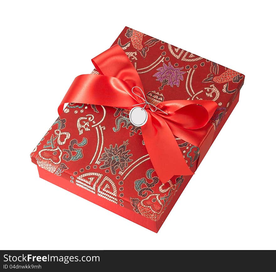 A beautiful fabric gift box with red ribbon