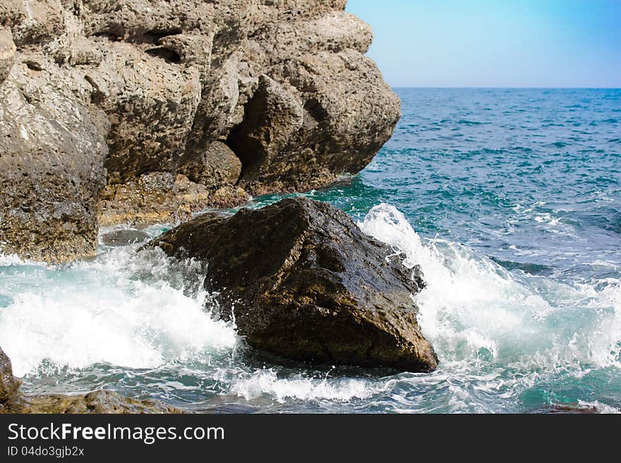 Sea waves breaking on the cliffs