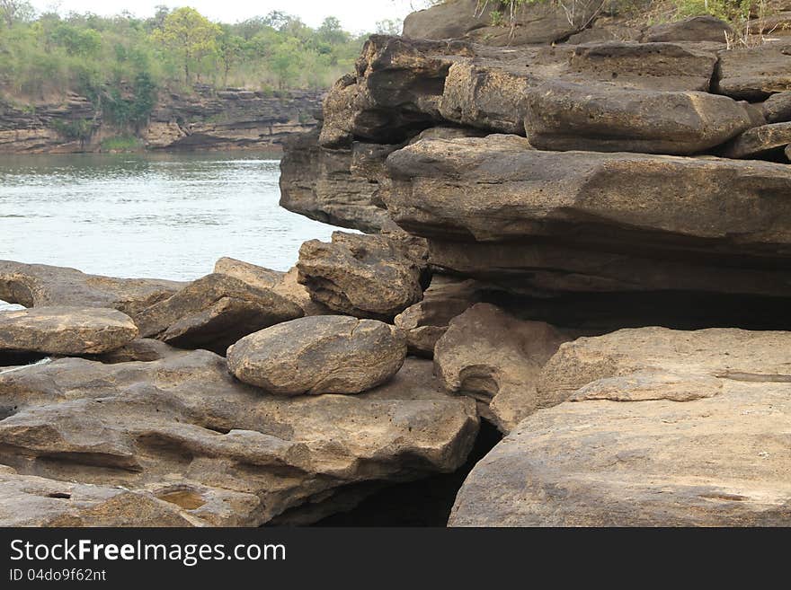 The traces of the river eroded the rock into a beautiful trail along the banks of the Mekong River between Thailand and Laos. The traces of the river eroded the rock into a beautiful trail along the banks of the Mekong River between Thailand and Laos.