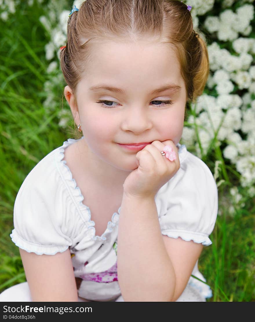 Portrait of thinking little girl outdoor