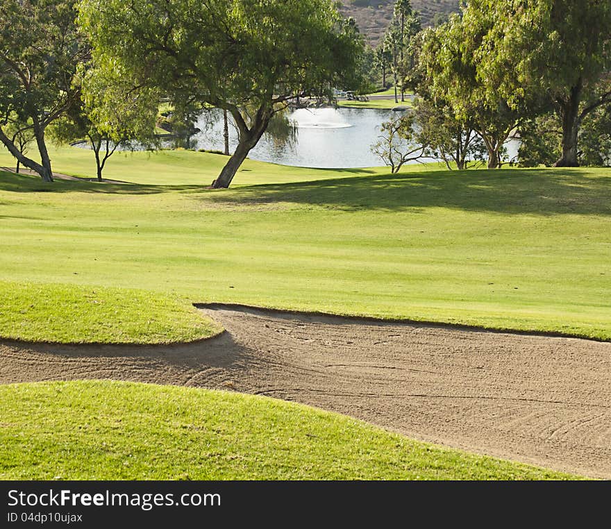 Golf course with sandtrap and lake