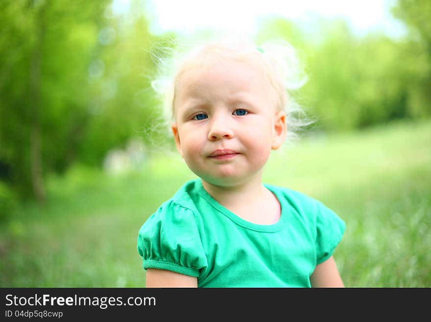 Portrait of a child against the nature of