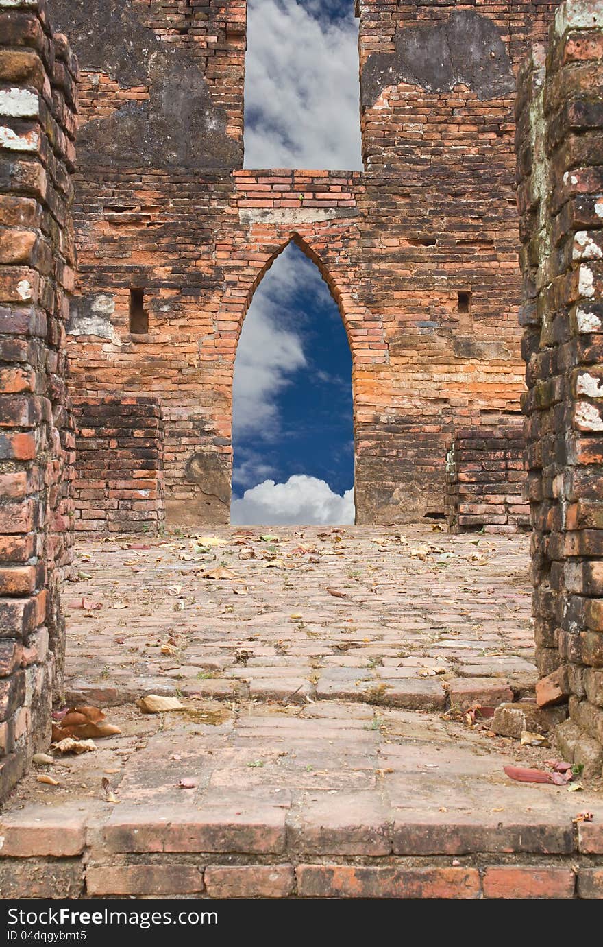 Old brick walls of the Buddhist church door, with the sky in the background. Old brick walls of the Buddhist church door, with the sky in the background.