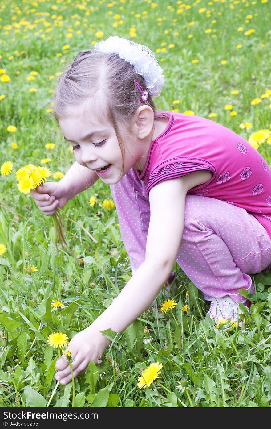 Young girl in a field of dandelions