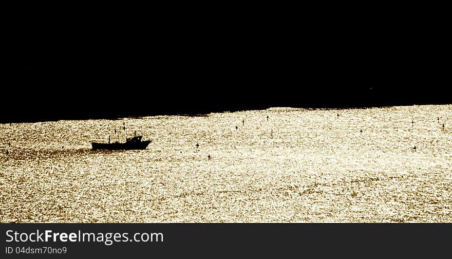 Fishermen's boat at dusk in Sorrento bay. Fishermen's boat at dusk in Sorrento bay