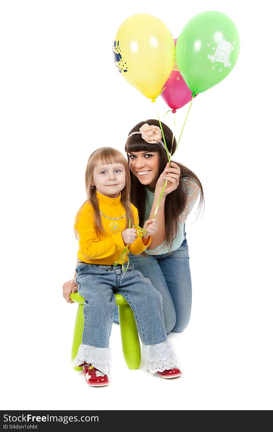 Studio shot of mother and daughter with balloons