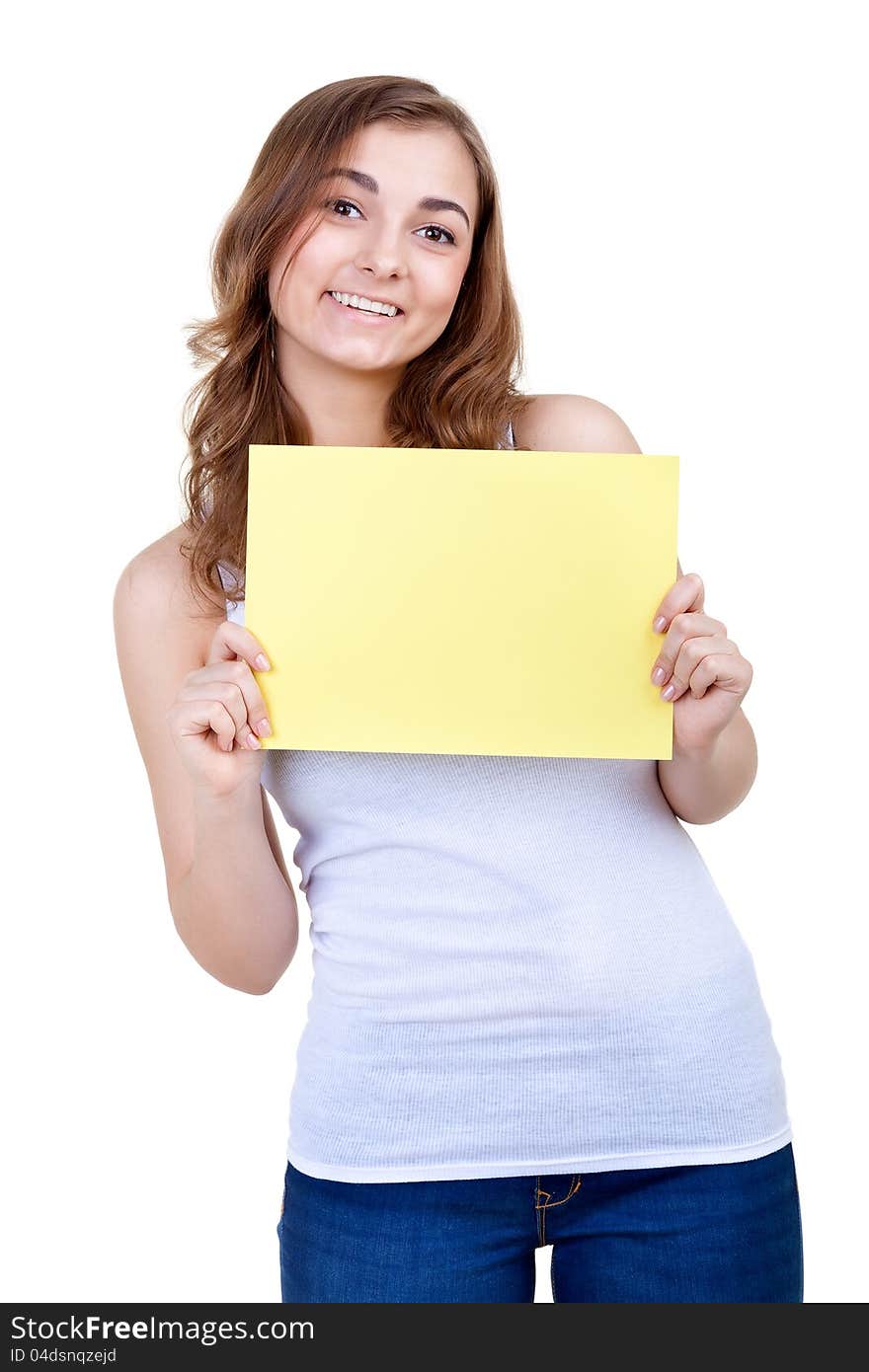 Young girl shows empty sheet of a yellow paper. Isolation on the white. Young girl shows empty sheet of a yellow paper. Isolation on the white